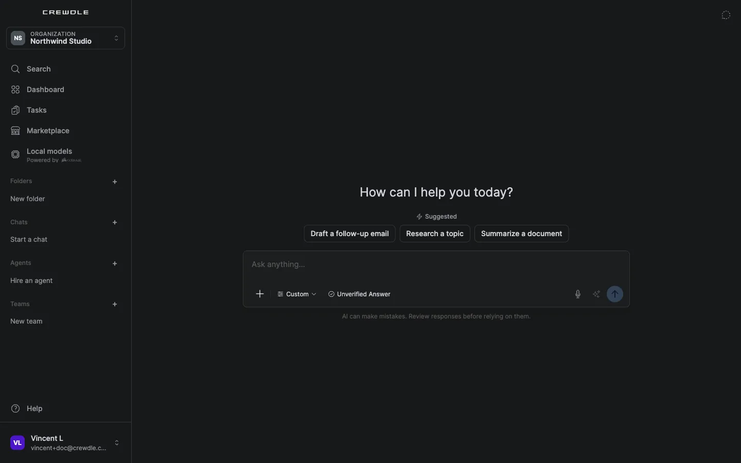 The Chat home in Crewdle: "How can I help you today?", suggested starters (draft a follow-up email, research a topic, summarize a document) and the message box with the mode menu, Unverified Answer and a microphone for dictation